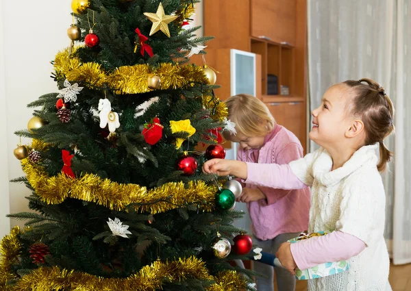 Little girls with Christmas tree — Stock Photo, Image