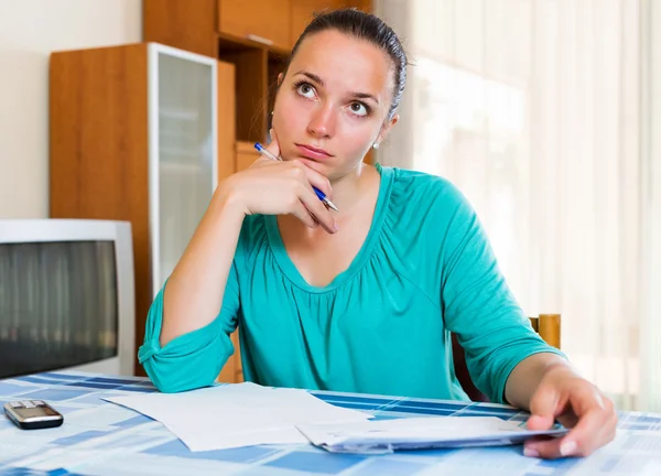 Sad girl with papers — Stock Photo, Image