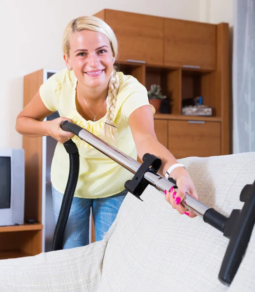 Woman using vacuum cleaner — Stock Photo, Image