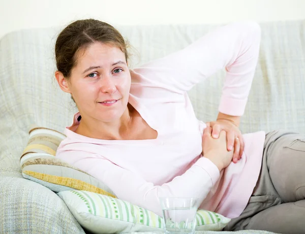 Adult brunette having abdominal pains — Stock Photo, Image