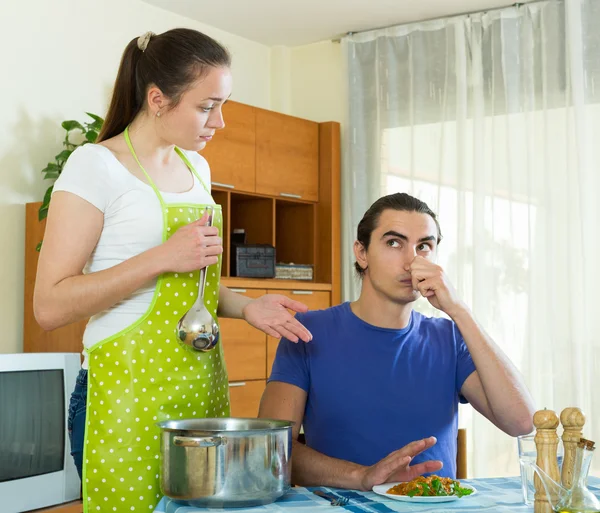 Woman serving food her man at table — Stock Photo, Image