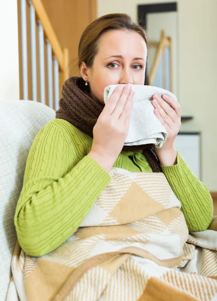 Sick lonely woman on sofa — Stock Photo, Image