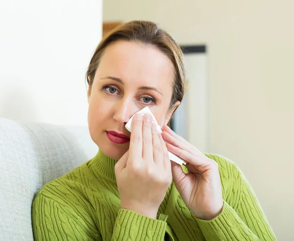 Unhappy lonely woman on sofa — Stock Photo, Image