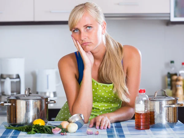 Exhausted female in apron — Stock Photo, Image