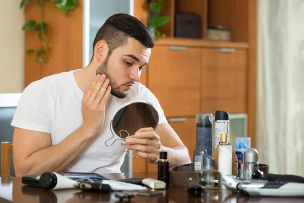 Man checks  problem skin — Stock Photo, Image