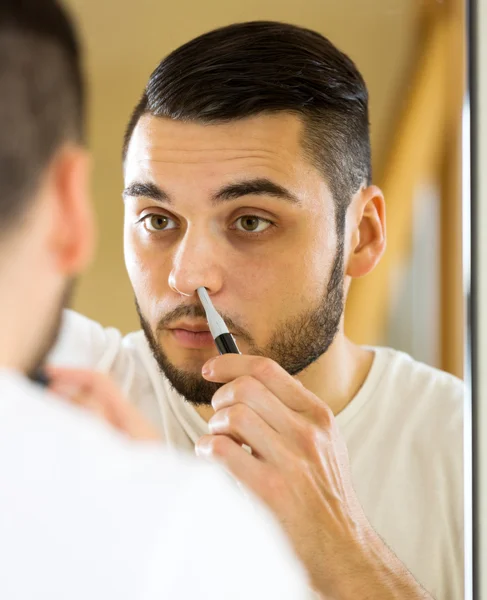 Removal of hair from nose — Stock Photo, Image