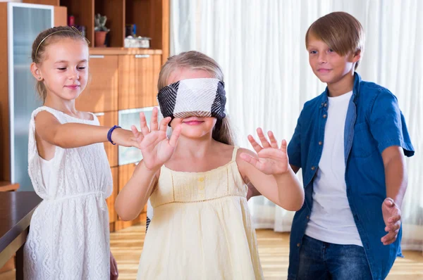 Happy kids playing with blindfold — Stock Photo, Image