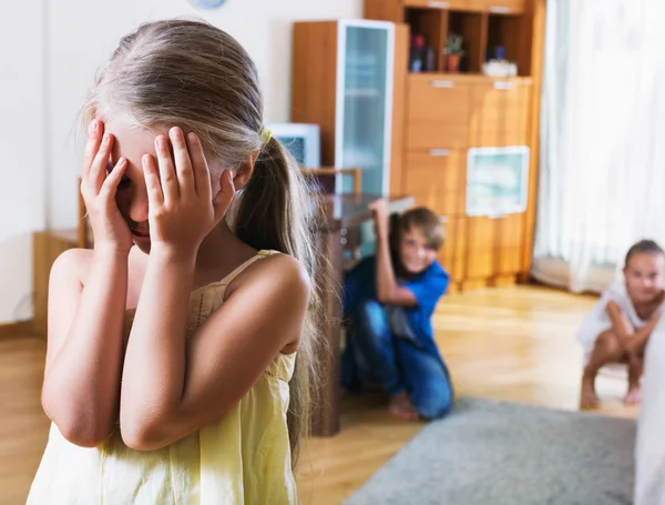 Joyful happy children hiding from girl — Stock Photo, Image