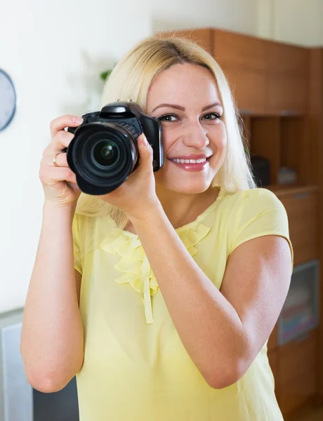 Joyful girl with professional photo camera — Stock Photo, Image