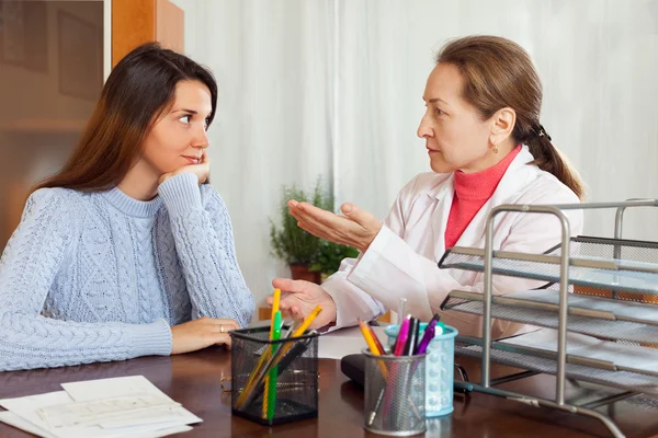 Teenager patient listening the doctor Stock Photo