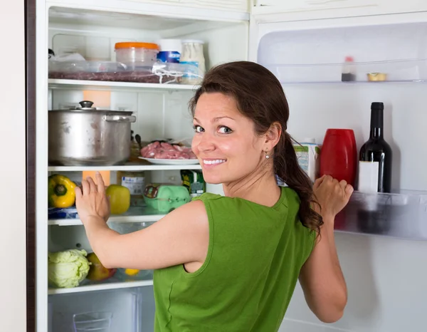 Woman searching eat in refrigerator at home — Stock Photo, Image