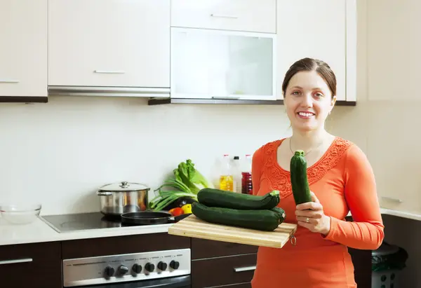 Positive woman with vegetable marrow — Stock Photo, Image