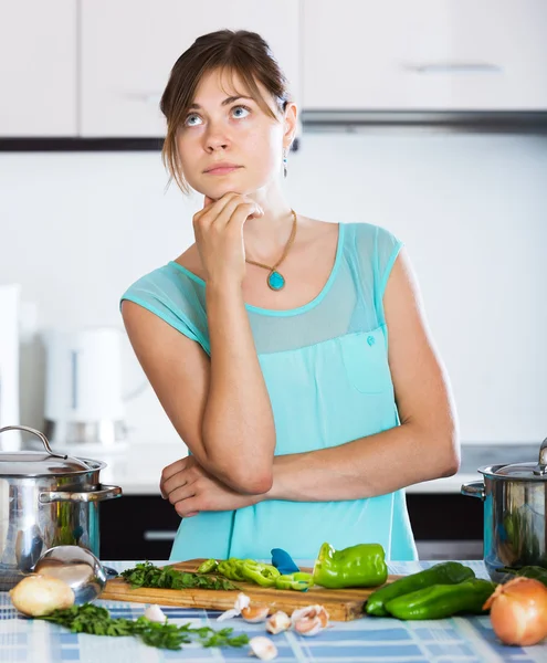 Sad housewife cooking dinner — Stock Photo, Image