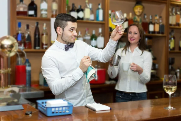 Bar employees serving clients — Stock Photo, Image