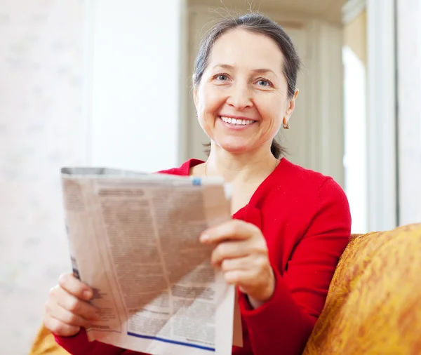 Joyful  woman with newspaper — Stock Photo, Image