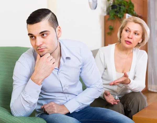 Quarrel of adult son and senior mother — Stock Photo, Image