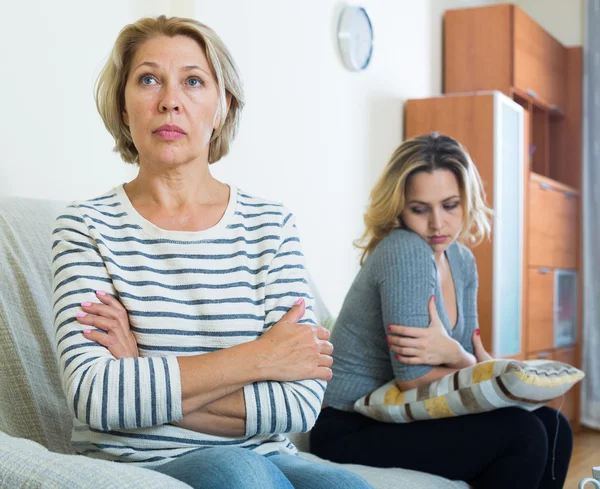 Upset young woman and senior mother — Stock Photo, Image