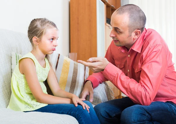 Man lecturing unpleased little girl — Stock Photo, Image