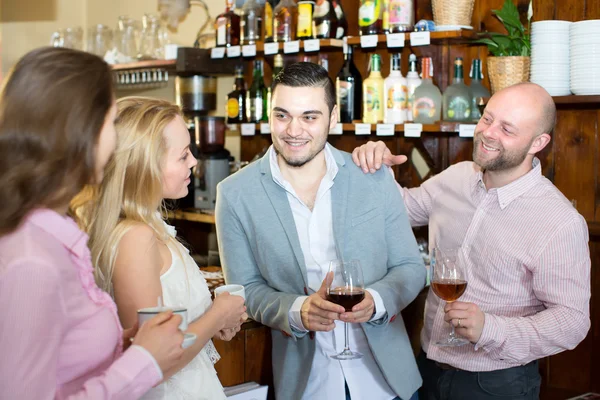 Company of friends in a bar — Stock Photo, Image