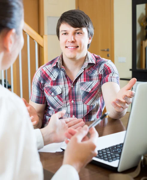 Girl talks with man while interviewing him — Stock Photo, Image