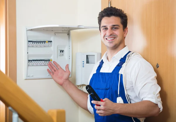 Man working with electric meter — Stock Photo, Image