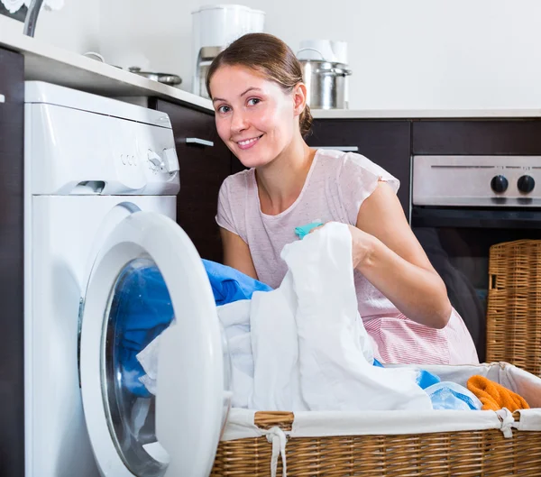 Happy housewife near washing machine — Stock Photo, Image