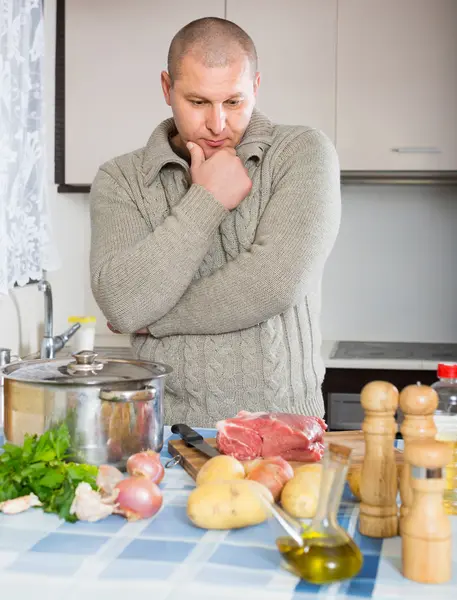 Man thinking what to cook for dinner — Stock Photo, Image