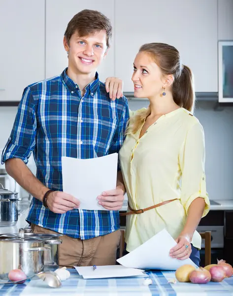 Smiling adult couple signing bank contract — Stock Photo, Image