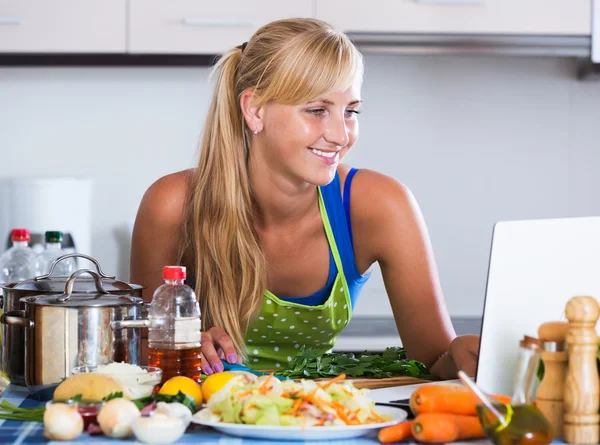 Woman searching recipe in internet — Stock Photo, Image