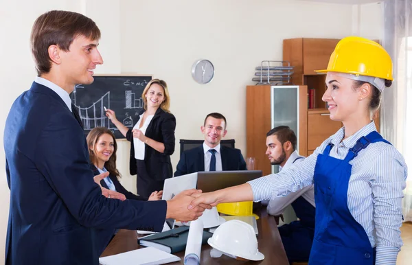 Planners with helmets in architecture bureau — Stock Photo, Image