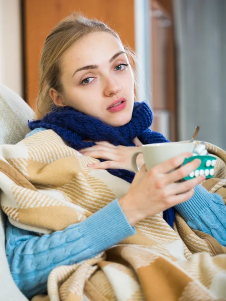 Woman having cold under plaid at home — Stock Photo, Image