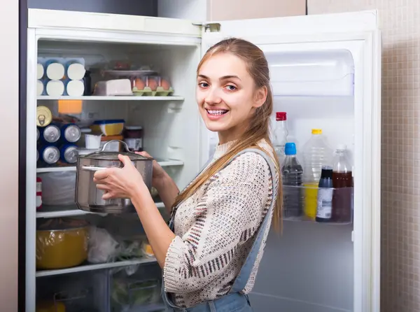 Housewife arranging products in fridge — Stock Photo, Image