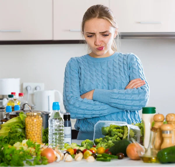 Woman recalling recipe for dinner in kitchen — Stock Photo, Image