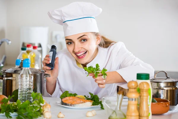 Cook with prepared salmon in professional kitchen — Stock Photo, Image