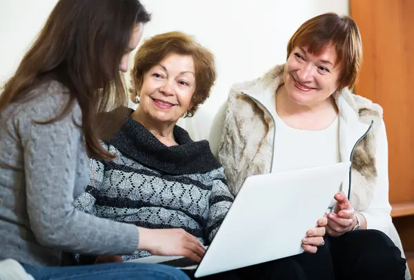 Three women with laptop — Stock Photo, Image