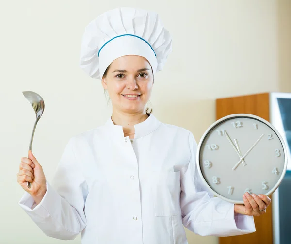 Professional chef holding big clock — Stock Photo, Image