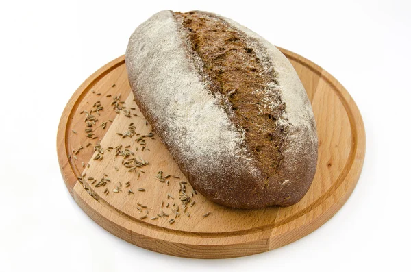 Chléb na dřevěné desce — Stock fotografie