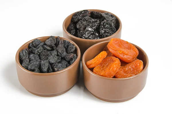 Dried fruits on a wooden board — Stock Photo, Image