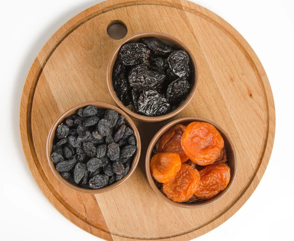 Dried fruits on a wooden board — Stock Photo, Image