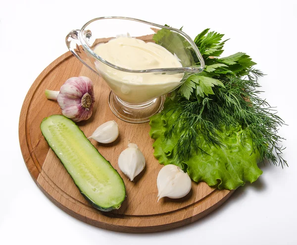 Spring vegetables on a wooden board — Stock Photo, Image