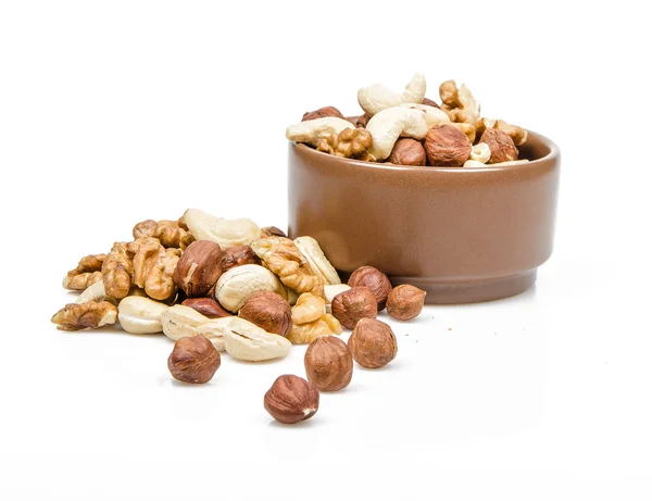 Nuts in ceramic bowl — Stock Photo, Image