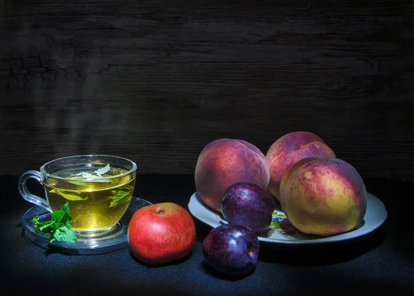 Herbal tea and fruits — Stock Photo, Image