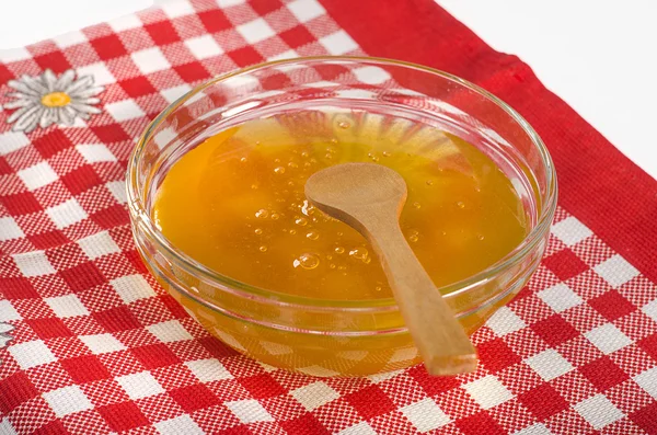 Honey in glass bowl — Stock Photo, Image