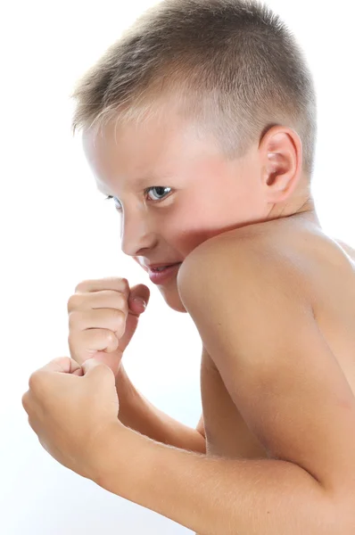Serious and determined young boy boxing — Stock Photo, Image