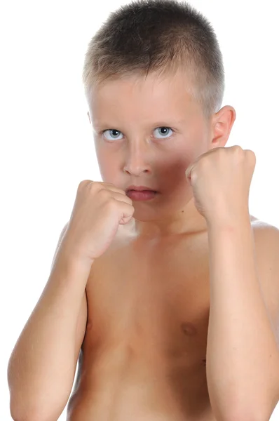 Serious and determined young boy wearing boxing — Stock Photo, Image