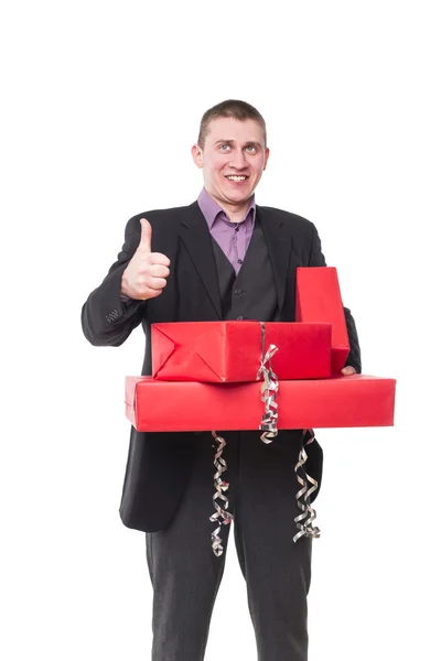 Чоловік у костюмі з подарунковими коробками — стокове фото
