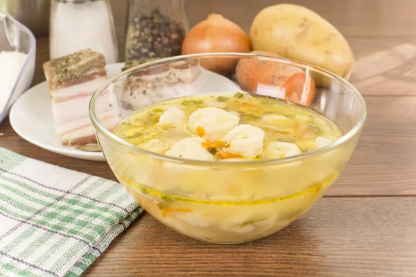 Soup with dumplings and ham — Stock Photo, Image