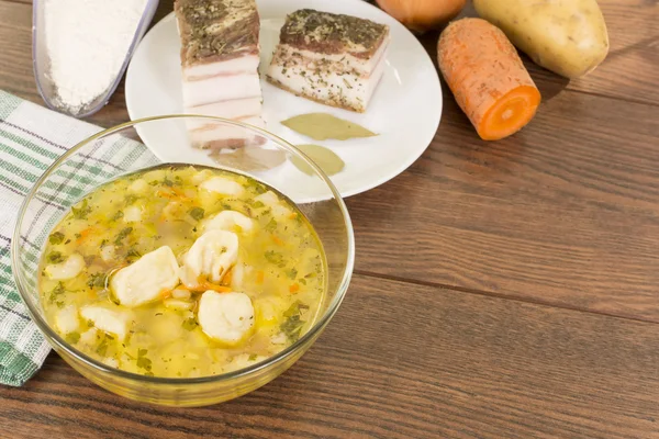 Soup with dumplings and ham — Stock Photo, Image