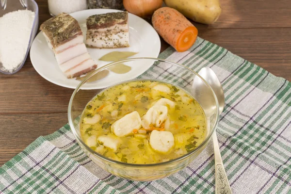 Soup with dumplings and ham — Stock Photo, Image