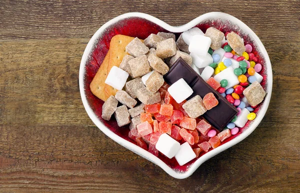 Diferentes tipos de açúcar, doces e biscoitos — Fotografia de Stock